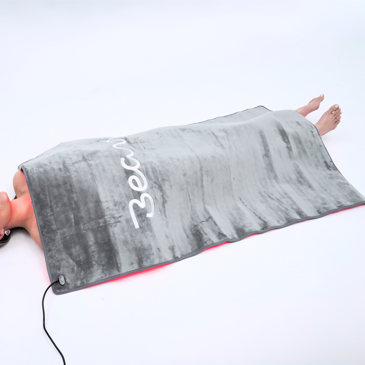 Beam Blanket draped over a person at home
