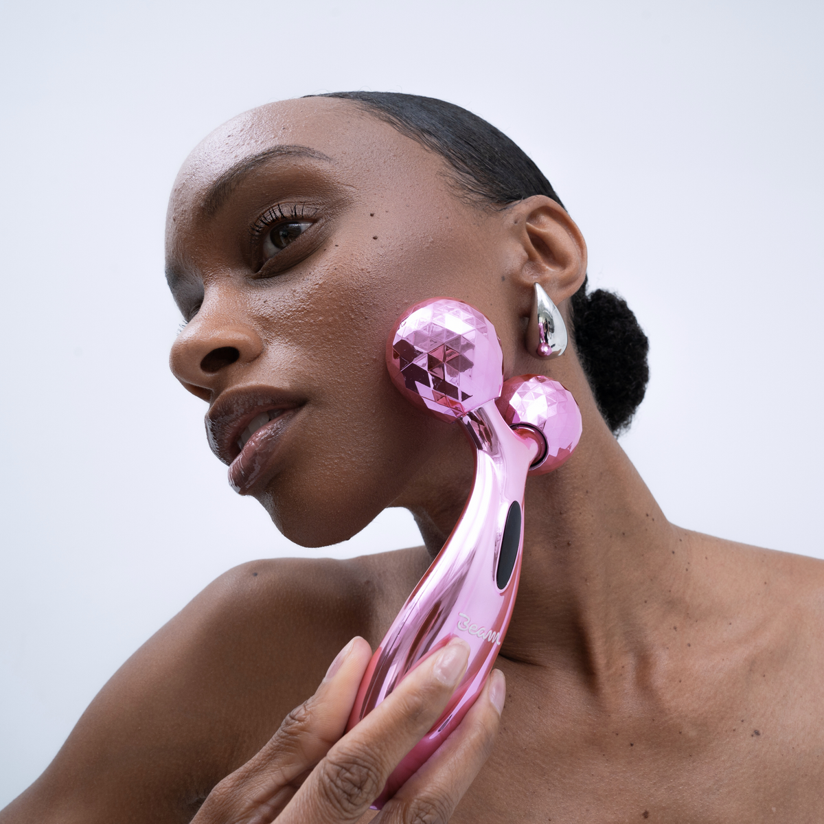 Beam Facial Roller being used on the cheek
